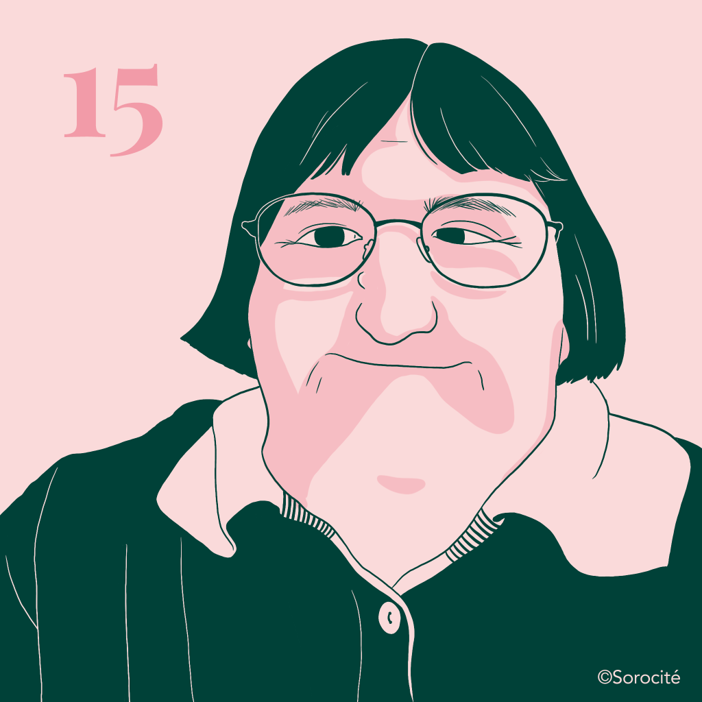 La militante Melissa Blake en format portrait, cheveux coupés au carré avec des grandes lunettes légèrement ovales. Le numéro 15 à gauche de sa tête. 